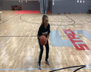 Maria Harper coaching her STACK Basketball Skills Academy
